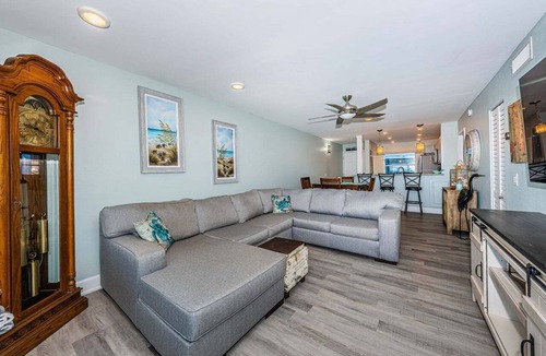 Casa del Mar Villa | Waterfront 2BR condo in St. Petersburg with balcony, pool, and hot tub.