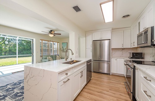 Coquina Sands House | West of 41. Walk 6 minutes to the Lowdermilk beach, theatre, mall and grocery.