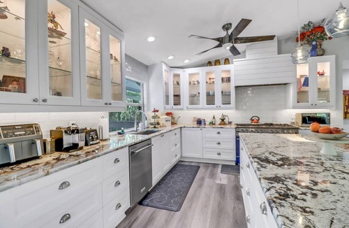 Truckland House | Your Hidden Florida Retreat | 4 King Suites, Luxury Kitchen, Heated Pool & Beach Adventures