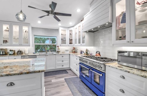 Truckland House | Your Hidden Florida Retreat | 4 King Suites, Luxury Kitchen, Heated Pool & Beach Adventures