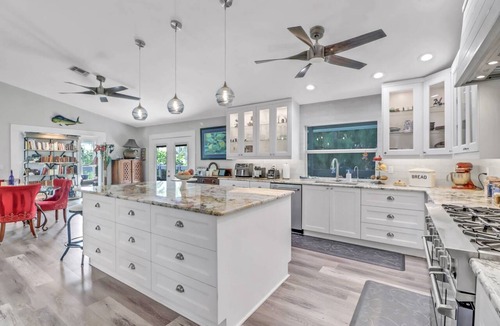 Truckland House | Your Hidden Florida Retreat | 4 King Suites, Luxury Kitchen, Heated Pool & Beach Adventures