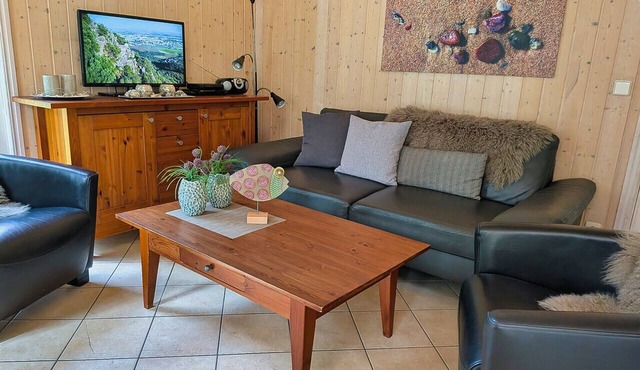 Austernperle 258 Vacation Home in Baabe. Relax in the hot tub and in your own sauna. Cozy evenings by the fireplace. A terrace right on the edge of the forest with exclusive teak lounge chairs. One parking space included in Baabe