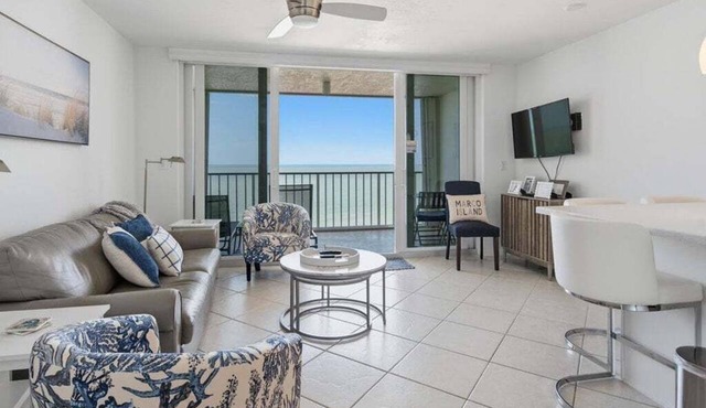 Beachfront 1BR Apollo condo with pool, kitchen, and Gulf views.