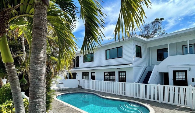 Beautiful Spacious 4 Bdrm 2nd floor Condo! Heated Pool and Steps to the beach!