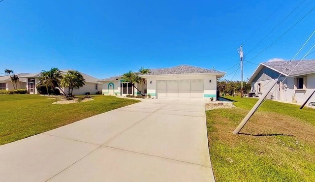Bohemian canal-front retreat with pool, beach gear, adult bikes, & AC - dogs ok