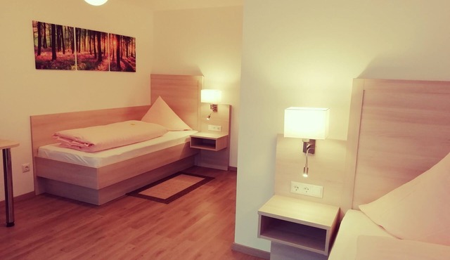 Comfortable twin room (24m2) with balcony in Grattersdorf