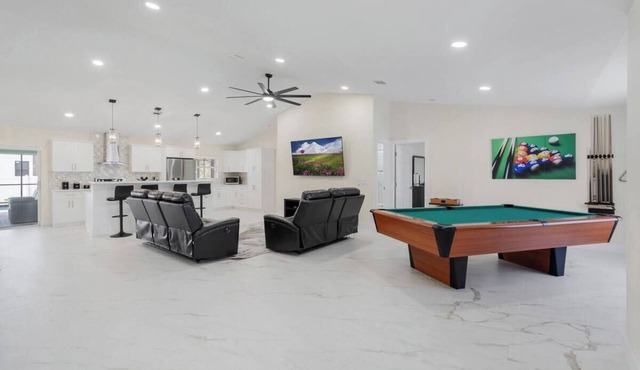 Home with heated pool and a pool table in Cape Coral