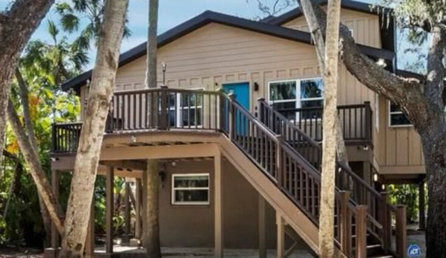 modern treehouse minutes from the #1 US beach!