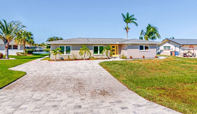 Riverfront home with beautiful views, private pool, screened lanai, grill, & W/D