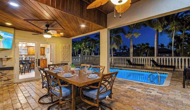 Striking European-style home w/private pool, hot tub & river access via dock