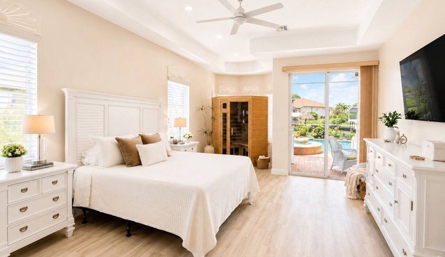This Villa has it all! Waterfront - heated pool, hot tub, boat dock, tiki hut!