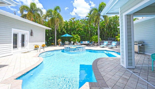 Unique Moorings home with personal gym, newly remodeled pool, 4 ensuite bedrooms