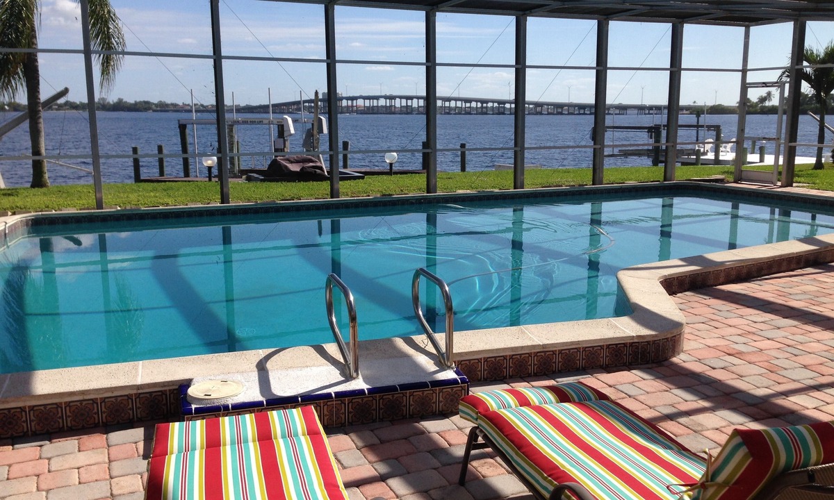 Caloosahatchee House | Casa Del Rio, Tropical Resort Feel, Breathtaking River Views, Large Pool & Dock