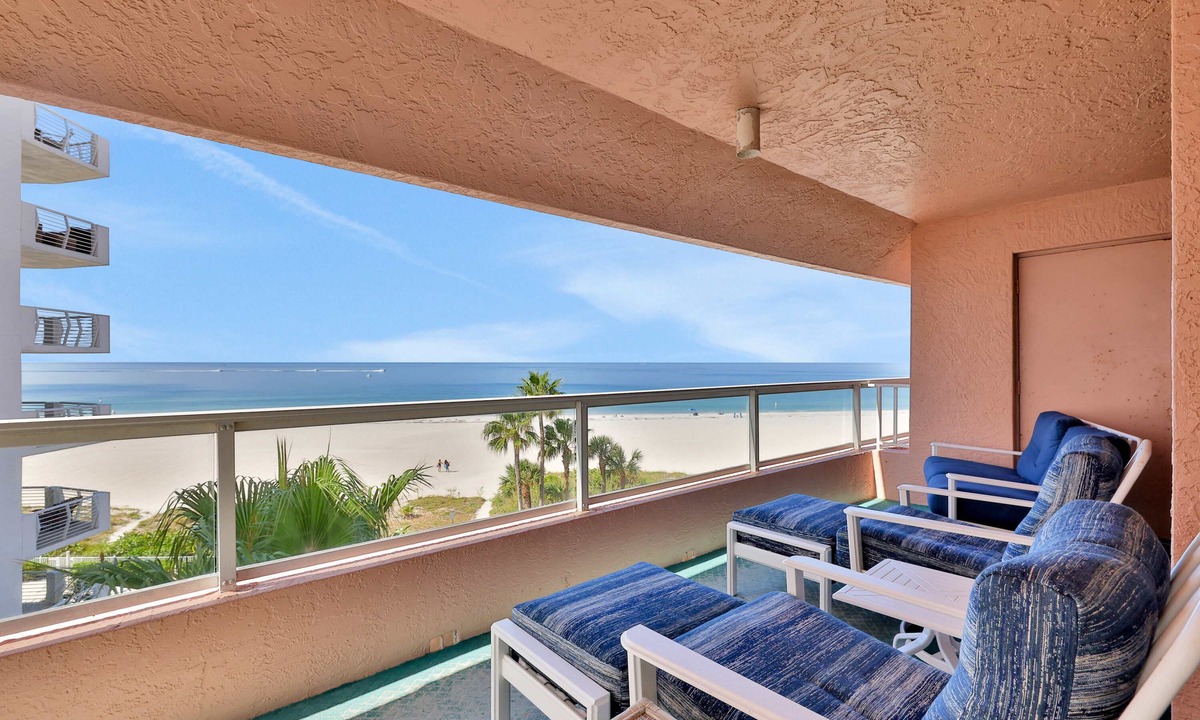 Sand Key Condo | Beachfront condo with multiple balconies heated pool gym hot tub and AC