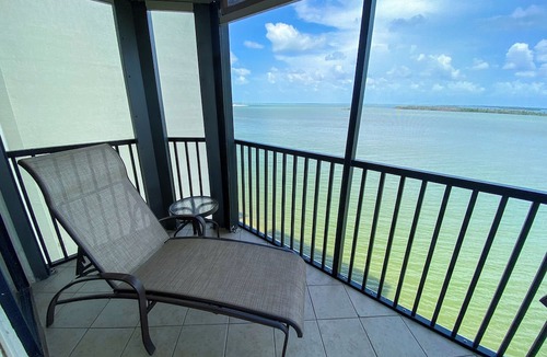 Punta Rassa Condo | Sanibel Harbour 817: Wrap-around lanai-Amazing Water Views! Enjoy private beach &activities nearby.