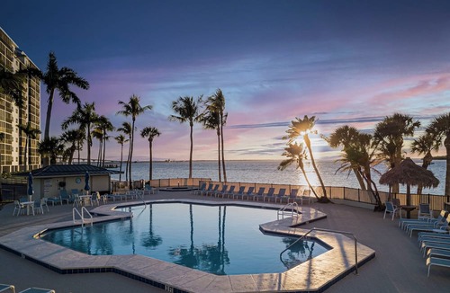 Punta Rassa Condo | Sanibel Harbour Resort Harbour Tower 315: Relaxing while watching for dolphins in the water below.