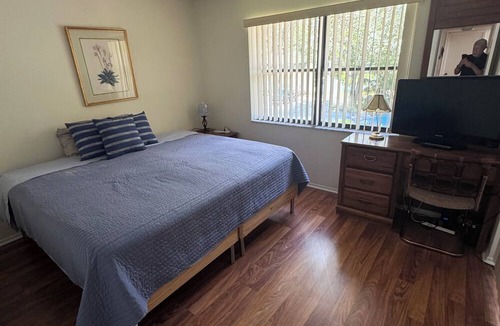 Oldsmar Condo | Breathtaking Lake Sunsets Golf Resort Gated Security Pool Tennis Pet Friendly”