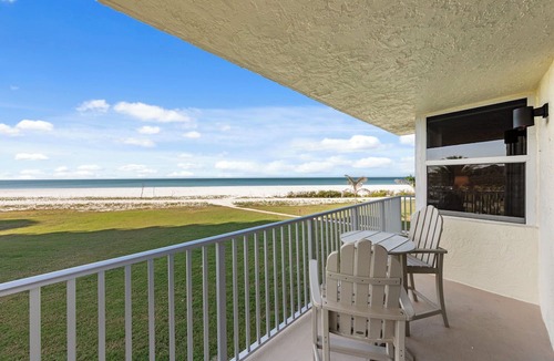 South Island Condo | Beachfront Estero Beach & Tennis Club 102B—Sunset Gulf Water Views, heated resort Pool, Pickleball & Tennis, 2 Bikes + beach Gear. 6-7 night stays