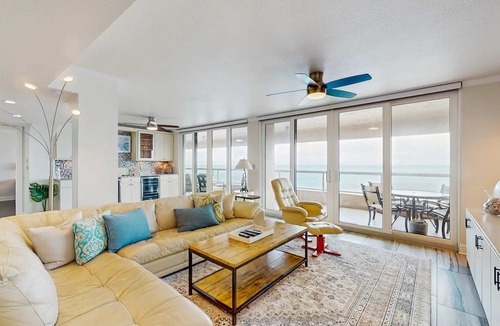 Sand Key Condo | Luxe penthouse with balcony sweeping views heated pool spa hot tub and gym