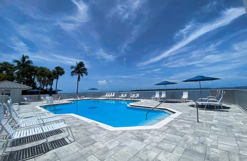 Punta Rassa Condo | Sanibel Harbour Resort 237: Experience the sunsets on this Waterfront wrap around lanai