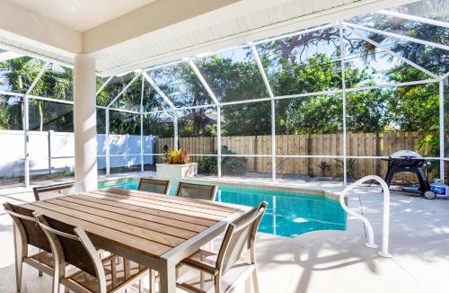 Naples Park House | Imola Vacation Rental - Remodeled Pool Home Minutes from Vanderbilt Beach! Family-Friendly Retreat with 4 BR 4 BA and Private Screened Pool!