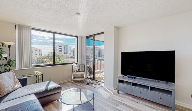 Bay & golf course-view condo with pool, spa, fishing pier, & private balcony