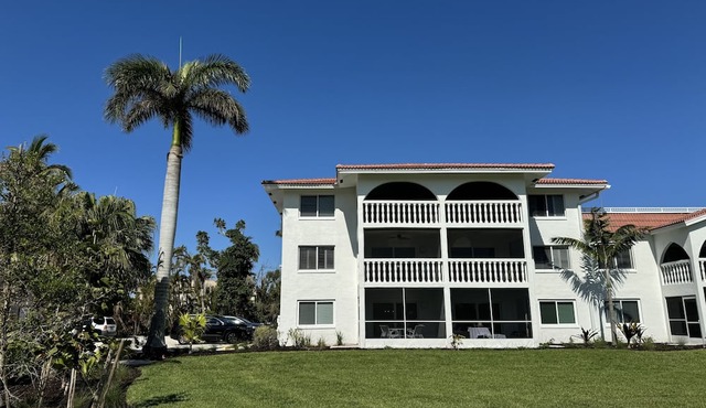 End unit with extra windows. Steps to the beach, private beach access!